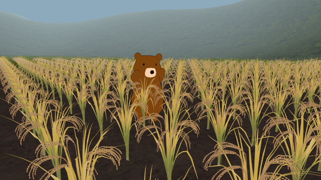 豊かに実った稲穂の中で佇む筆者