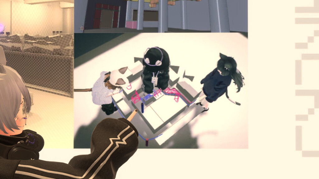 会議をする三人の写真